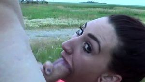  Tattooed brunette milf gives a hot blowjob in the outdoors