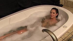  Young hottie getting massaged in a bathtub